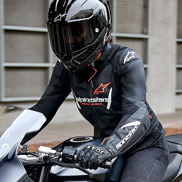 alpinestars_jacket_leather_ladies_faster-v3_black-white-fluo-coral_lifestyle2.jpg