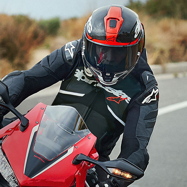 alpinestars_racing-motorcycle-helmet_supertech-r10_element-black-carbon-bright-red-gloss-white_lifestyle2.jpg