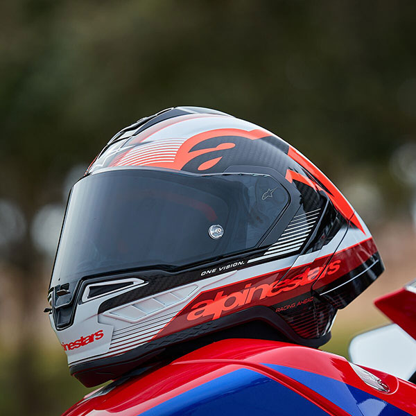 alpinestars_racing-motorcycle-helmet_supertech-r10_team-gloss-black-carbon-red-white_lifestyle1.jpg