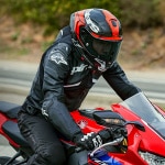 alpinestars_racing-motorcycle-helmet_supertech-r10_element-black-carbon-bright-red-gloss-white_lifestyle1.jpg