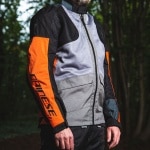 dainese_textile_jacket_air-tourer_frost-grey-flame-orange-black_lifestyle1.jpg